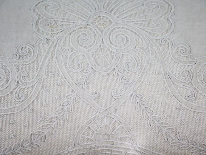 Antique embroidered tulle on linen bolster by Charlotte Casadéjus